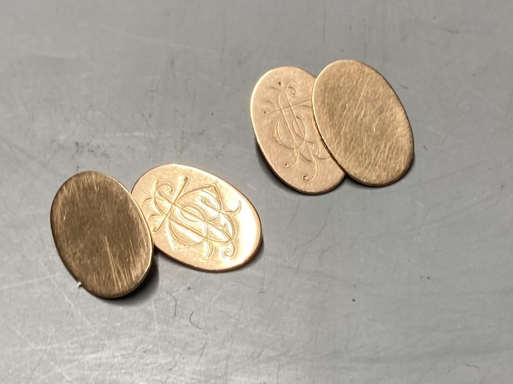 Two pairs of 9ct yellow gold oval cufflinks, a pair of silver cufflinks and two stick pins